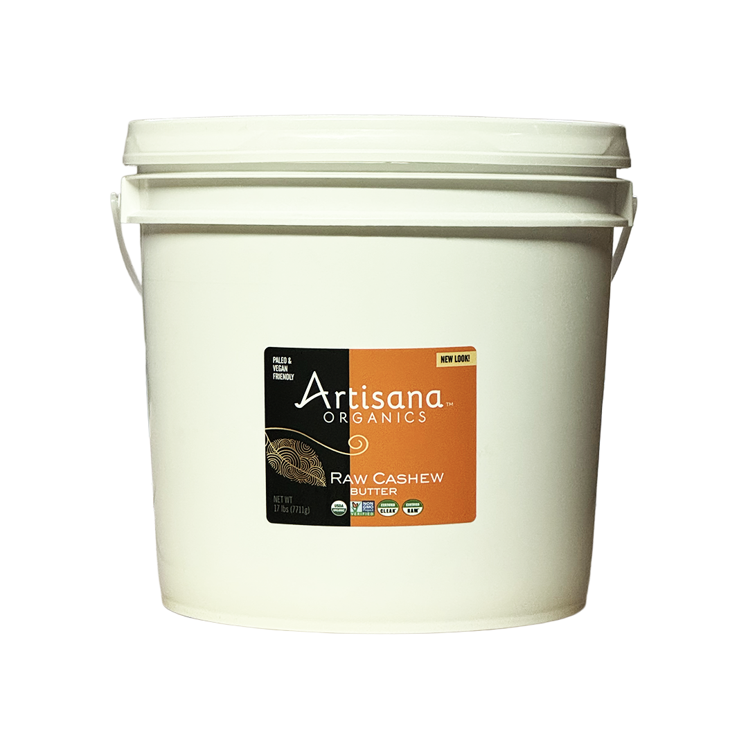 A white plastic bucket of Artisana Organics Raw Cashew with a black and orange label