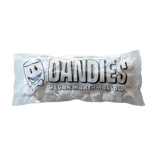 A package of Dandies Classic Vegan Marshmallows, showing the white marshmallows visible through a clear plastic bag with bold black and white branding.