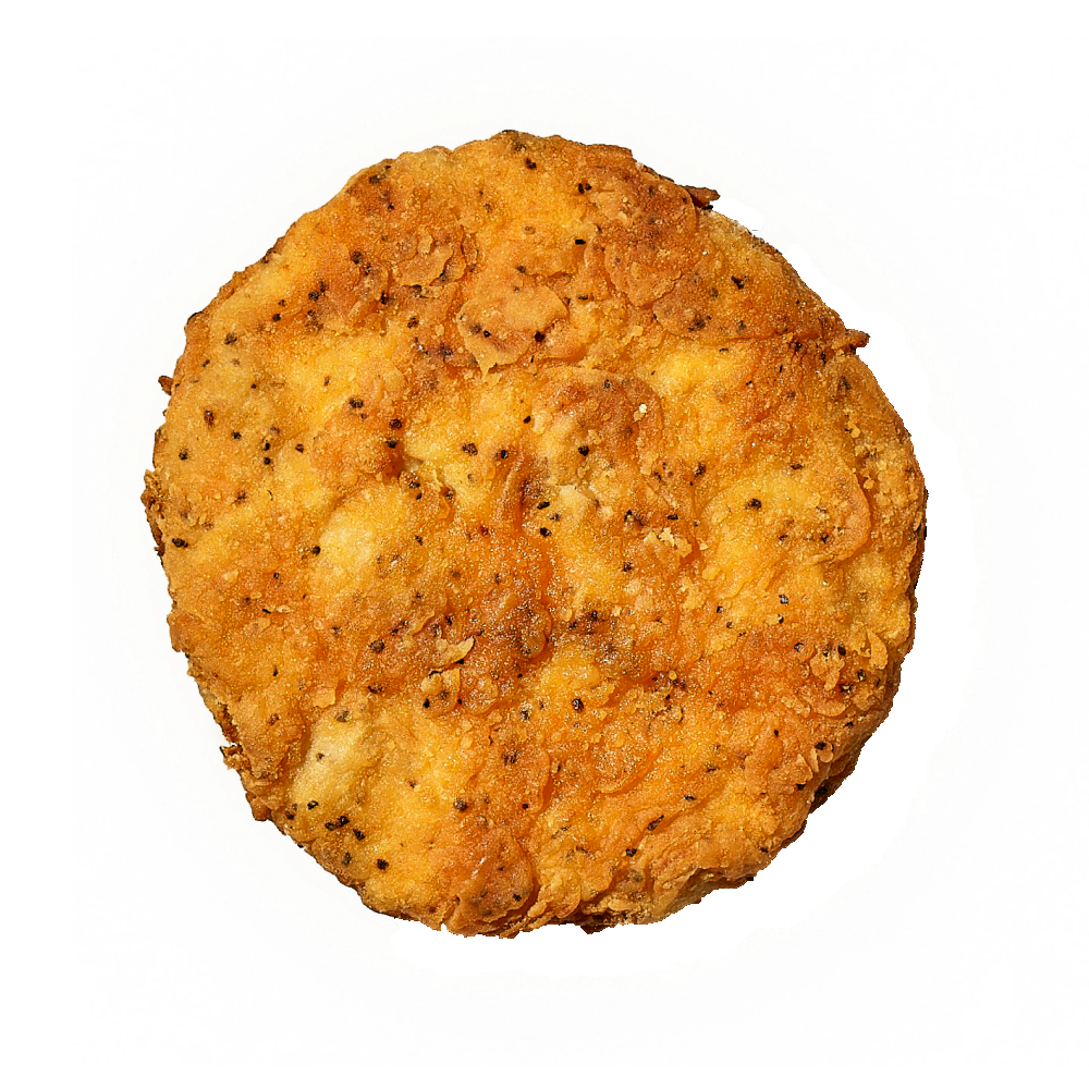 A single cooked Daring Plant-Based Breaded Chicken Patty, photographed from above