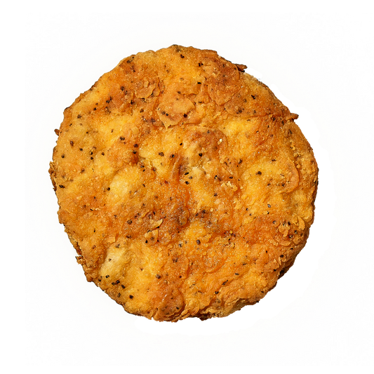 A single cooked Daring Plant-Based Breaded Chicken Patty, photographed from above