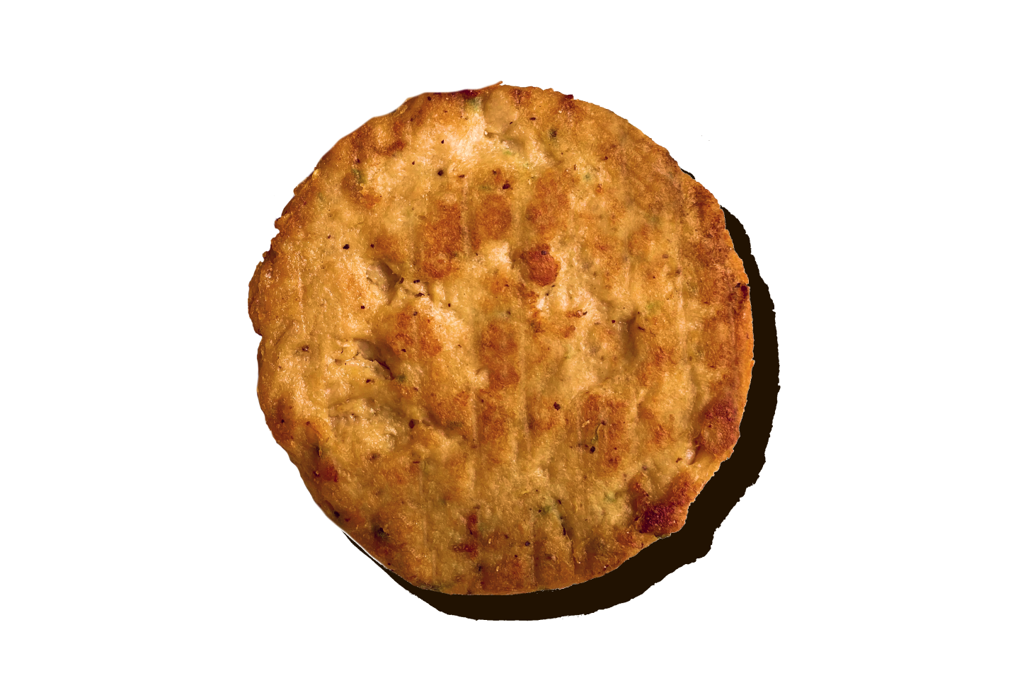 A cooked Daring Plant-Based Unbreaded Gluten-Free Chicken Patty shown from a top-down perspective