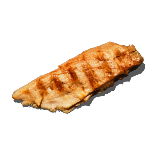 A single grilled Daring Plant-Based Unbreaded Gluten-Free Chicken Piece with visible grill marks and a glossy glaze