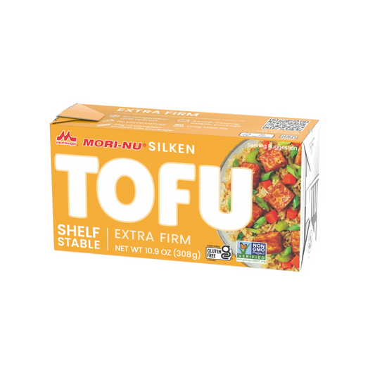 A box of Mori-Nu Extra Firm Silken Tofu, with a picture of the tofu product and vegetables on the front.