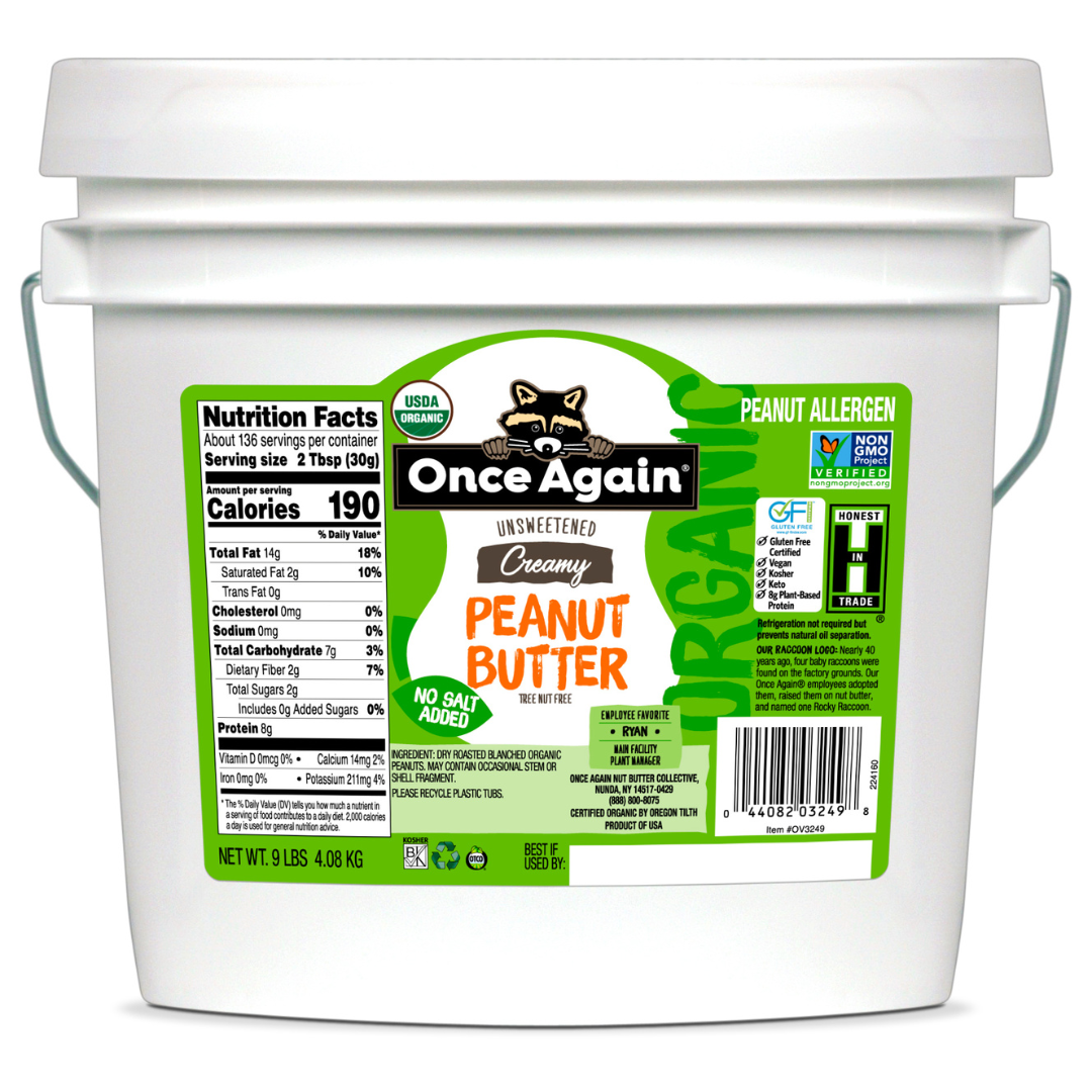 A 9 lb tub of Once Again Organic Creamy Peanut Butter, Unsalted. The label includes nutrition facts, a 'Gluten Free' badge, and allergen information.