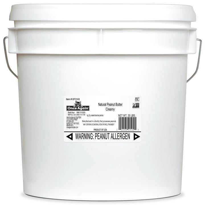 A 35 lb plastic tub of unsalted Once Again Natural Creamy Peanut Butter with a plain label showing the brand name, product name, and allergen information.
