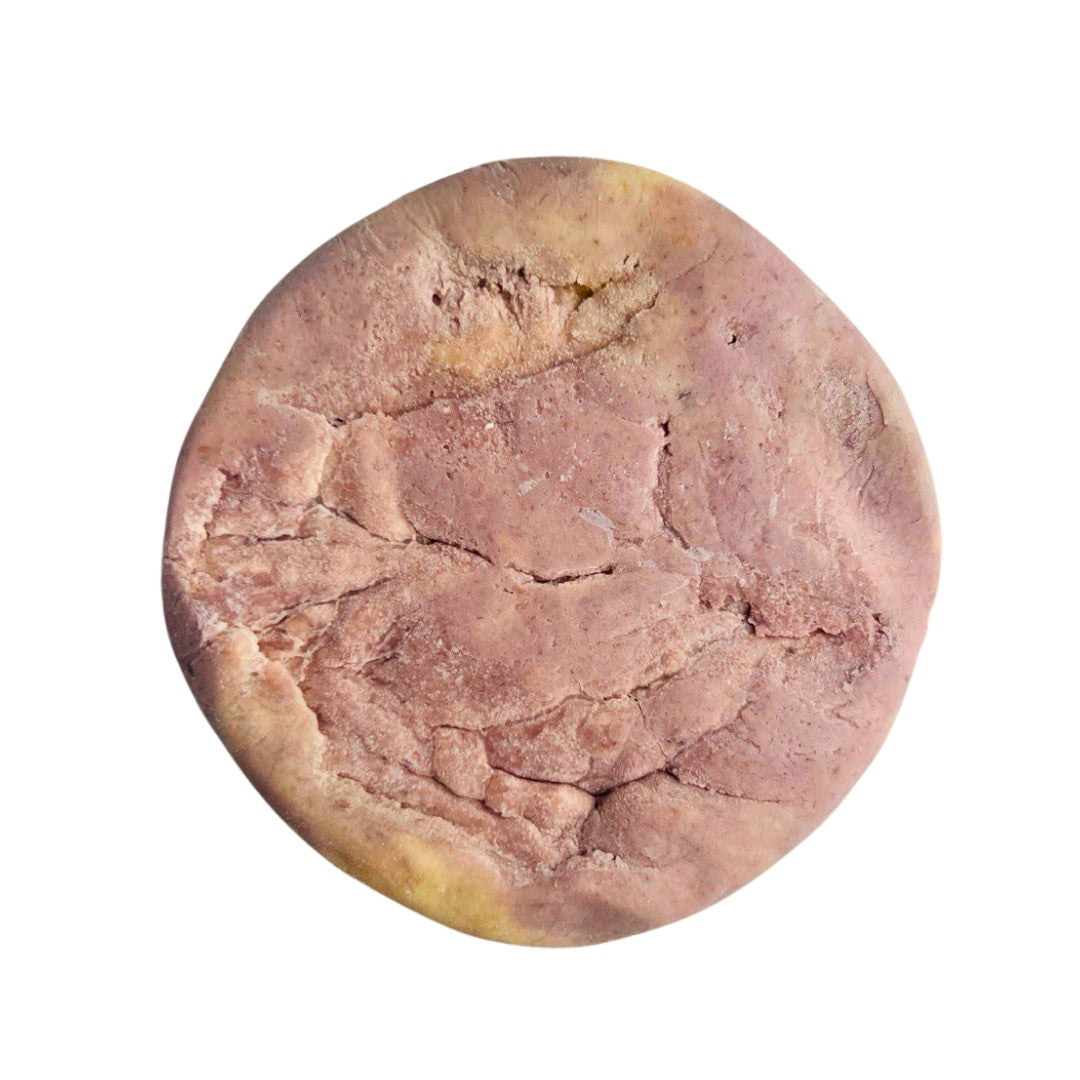 A marbled wine colored wheel of Rose City Creamery Plant Based Perfect Pinot cheese