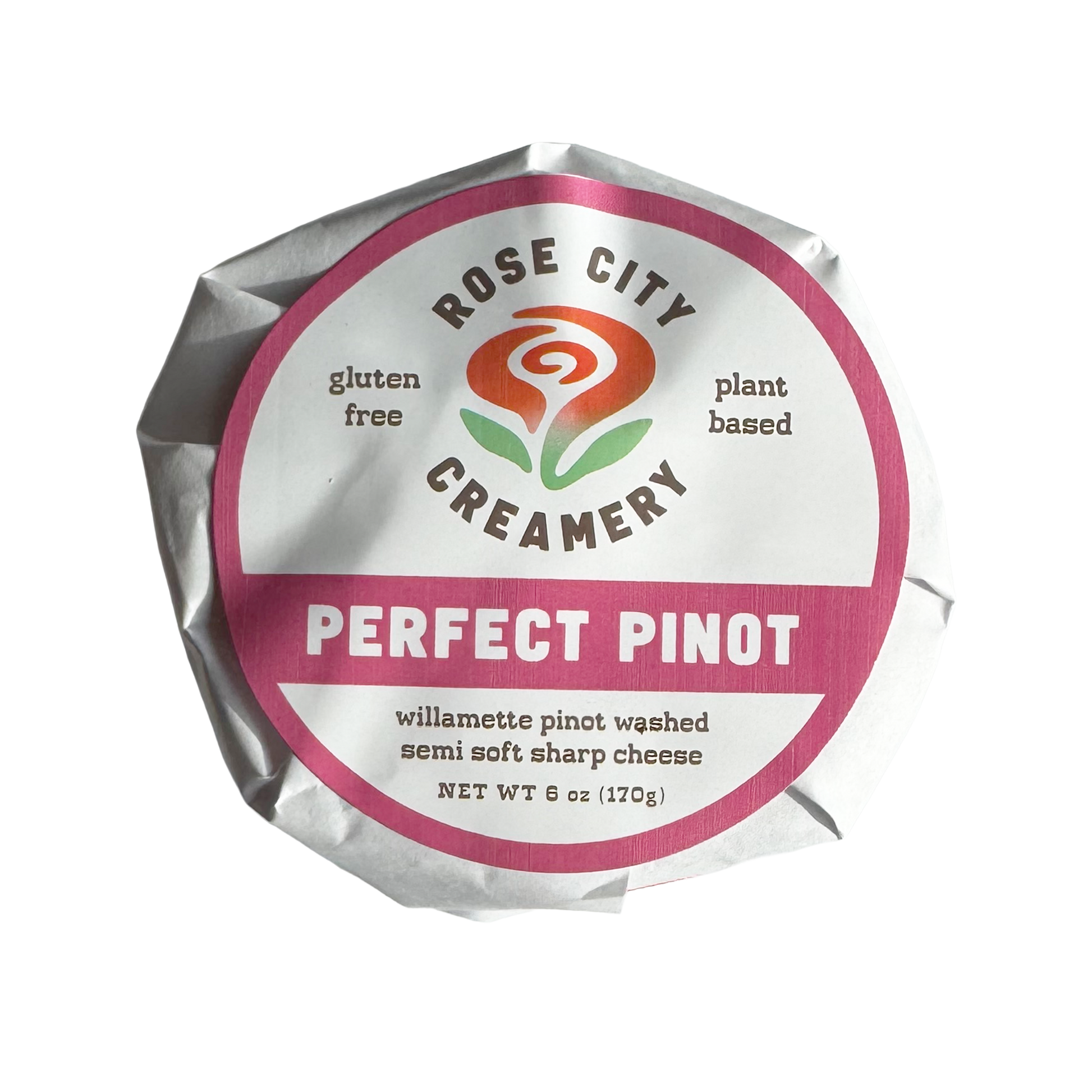 A wrapped wheel of Rose City Creamery Perfect Pinot cheese. The label is white with fuchsia accents and an abstract swirly rose logo