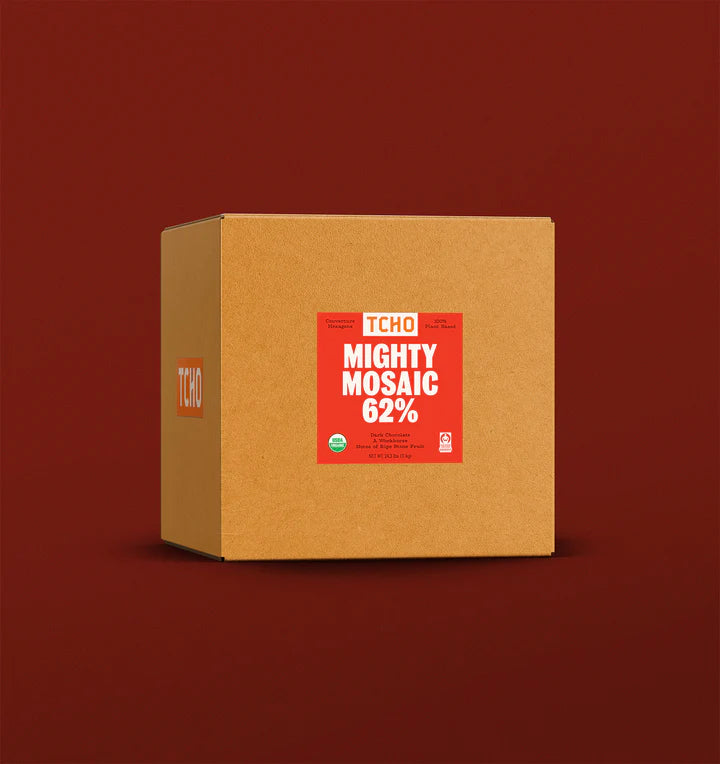 A brown cardboard box with a red label that says "TCHO Mighty Mosaic 62%"